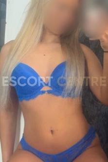 Blonde escort Kelsey looks stunning in blue lingerie